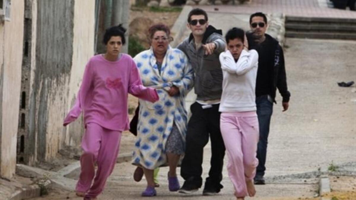 Israelis run to take cover in a shelter during a Palestinian rocket attack on the southern Israeli city of Beersheva, about 40 kilometres from the Gaza Strip as two Grad rockets fired by Gaza militants slammed into Beersheva.