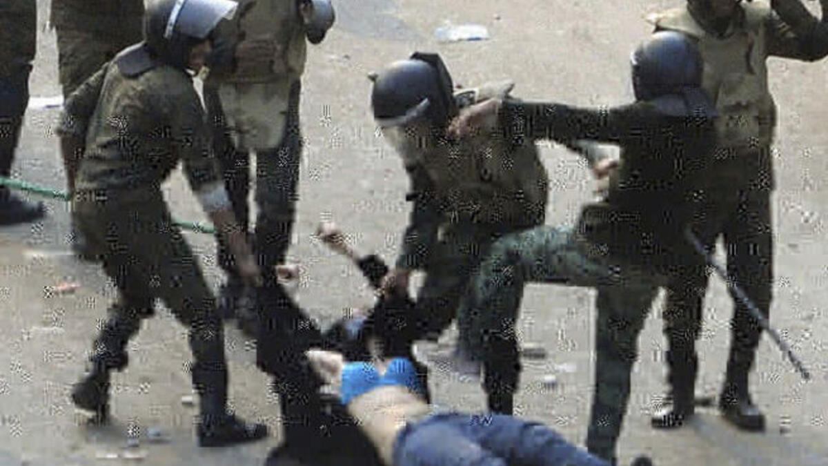 Blue bra girl: More 'army versus people' post-Mubarak disappointments were in store, when the transitional ruling military showed brutality against the vulnerable people. Their treatment of female protestors, especially, re-opens questions of Egypt's change post-Mubarak. This exposed woman was a veiled Egyptian protestor.