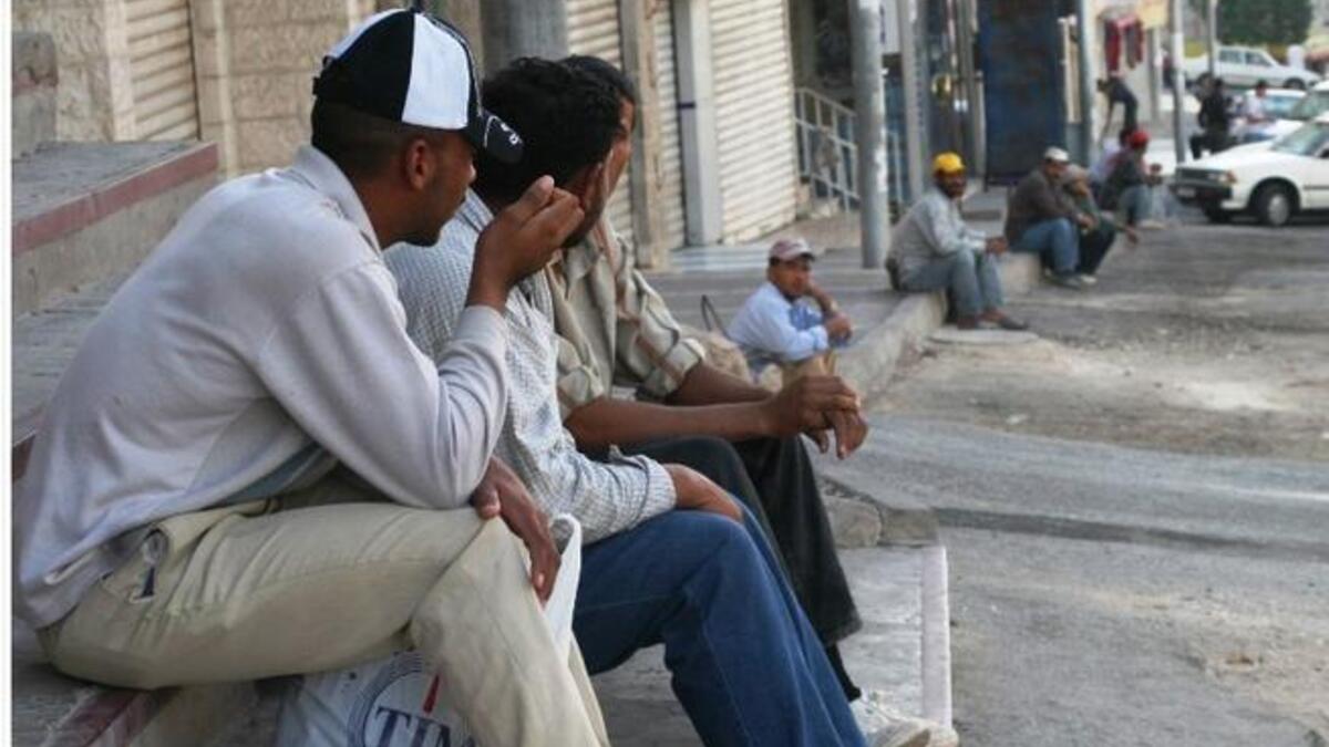 Migrant Egyptian workers line the streets in Morsi's time, promised to deliver employment