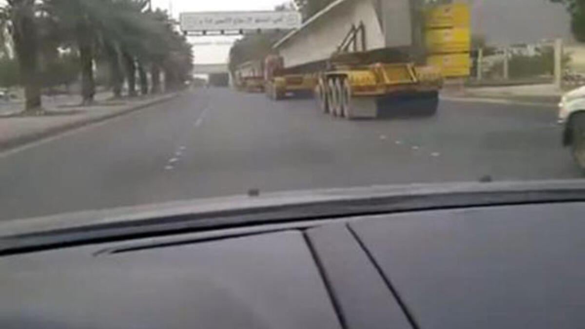 Extreme Saudi driving: Car-chase enthusiasts got a charge after viewing a Saudi daredevil weaving erratically in and out of traffic. The scary part? He was driving his car underneath trucks carrying large cement pylons...for the second time! Bruno Mars, the artist playing on the man's radio, did not seem to mind.