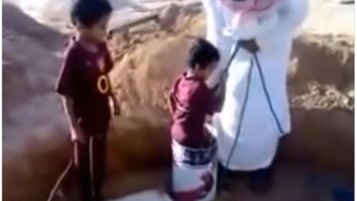 Throw the child down the well? The Saudi public was outraged when this video showing a father lowering his five-year-old son into a well in a bucket to clean it hit the web. Only weeks before this video was released, a child had died from falling into a similar type of well. In this video, the child is noticeably distressed.