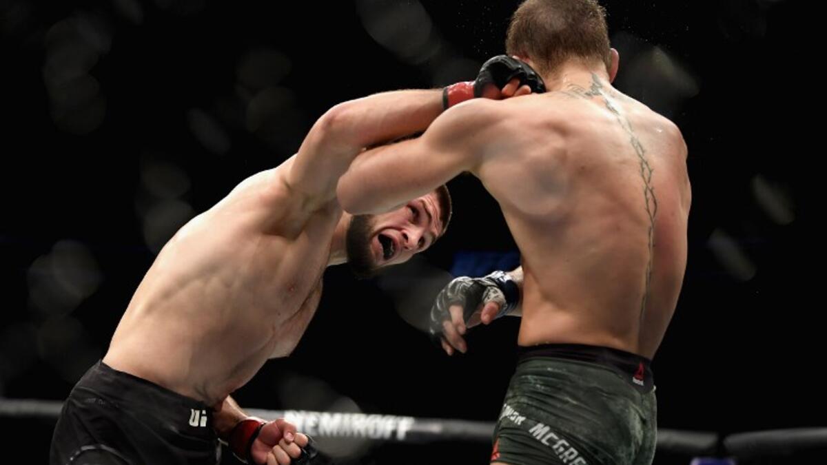 LAS VEGAS, NV - OCTOBER 06: Khabib Nurmagomedov of Russia (L) punches Conor McGregor of Ireland in their UFC lightweight championship bout during the UFC 229 event inside T-Mobile Arena on October 6, 2018 in Las Vegas, Nevada. Harry How/Getty Images/AFP
Harry How / GETTY IMAGES NORTH AMERICA / AFP