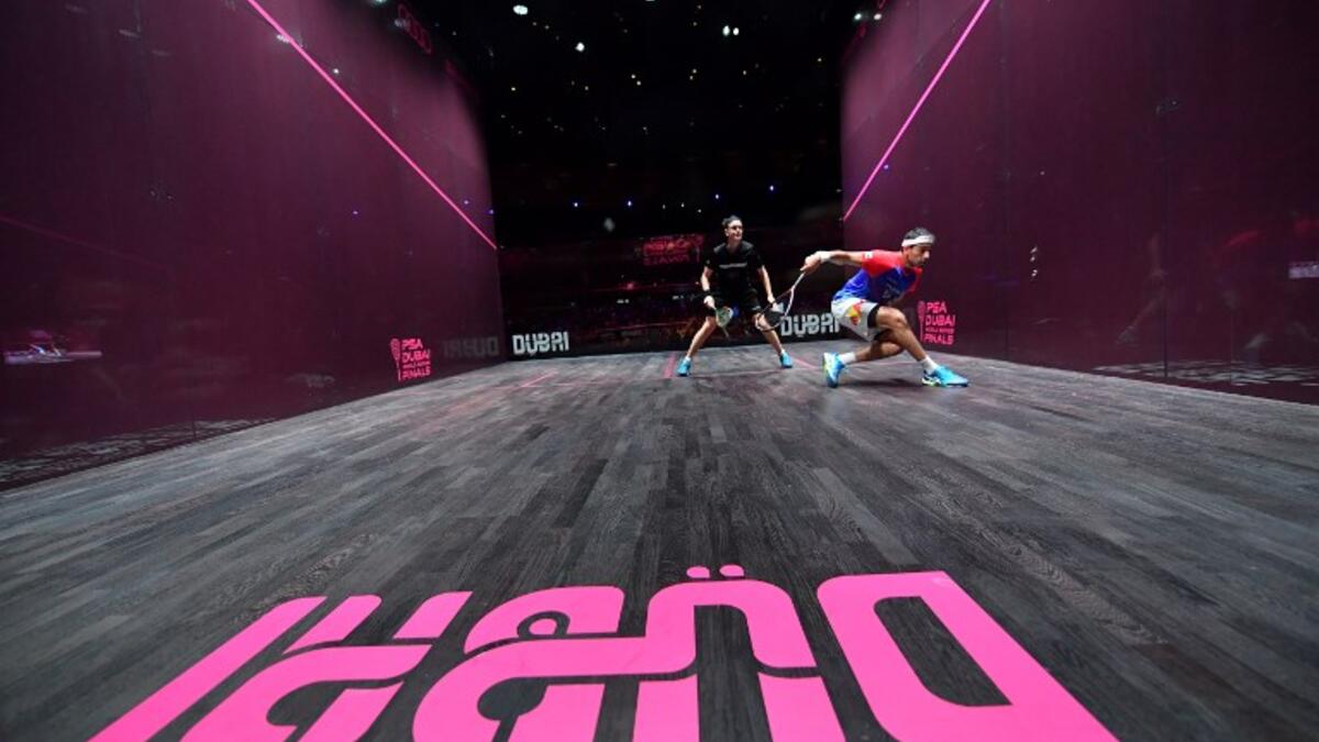 Mohamed El Shorbagy of Egypt (R) competes against James Willstrop of England during the finals of the PSA Dubai World Series Finals 2017 at Dubai Opera on June 10, 2017 in Dubai, United Arab Emirates.
GIUSEPPE CACACE / AFP