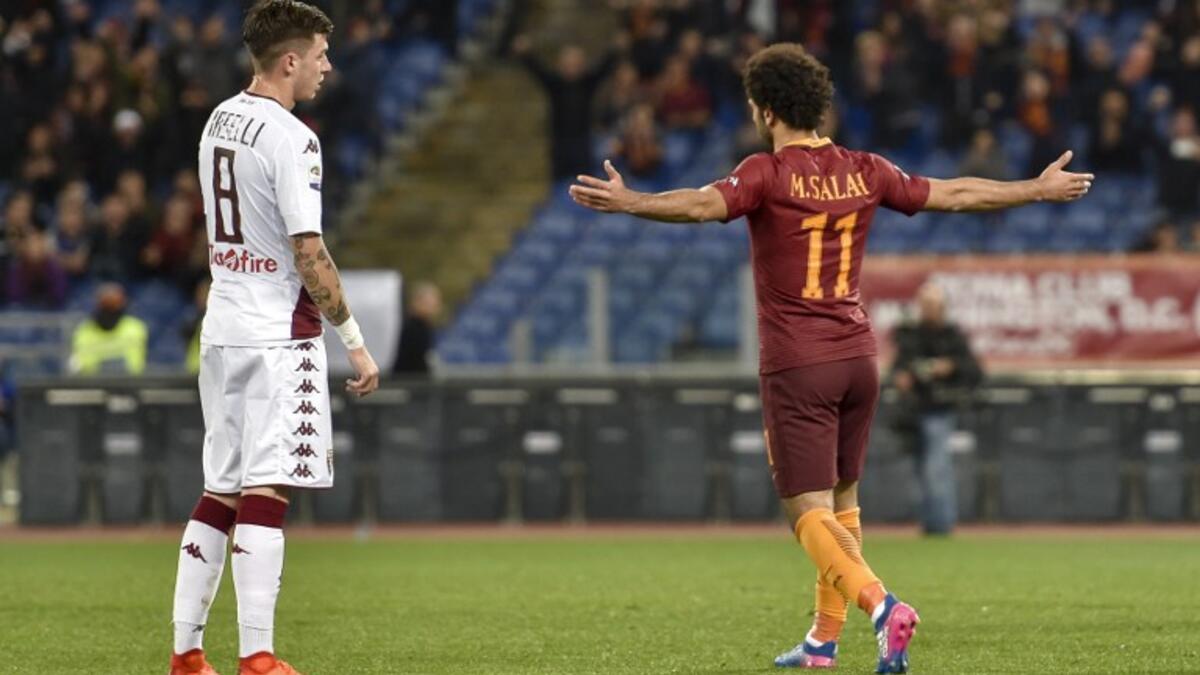 AS Roma's midfielder from Egypt Mohamed Salah (R) celebrates after scoring Torino , during the Italian Serie A football match AS Roma versus Torino on February 19, 2017 at Rome's Olympic stadium.
ANDREAS SOLARO / AFP
