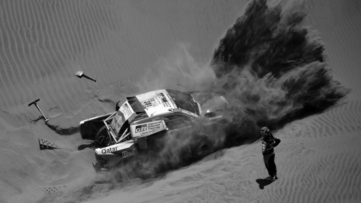 Toyota's driver Nasser Al-Attiyah of Qatar and his co-driver Matthieu Baumel of France get stuck in the sand dunes during Stage 4 of the Dakar 2018, in and around San Juan De Marcona, Peru, on January 9, 2018.
FRANCK FIFE / AFP