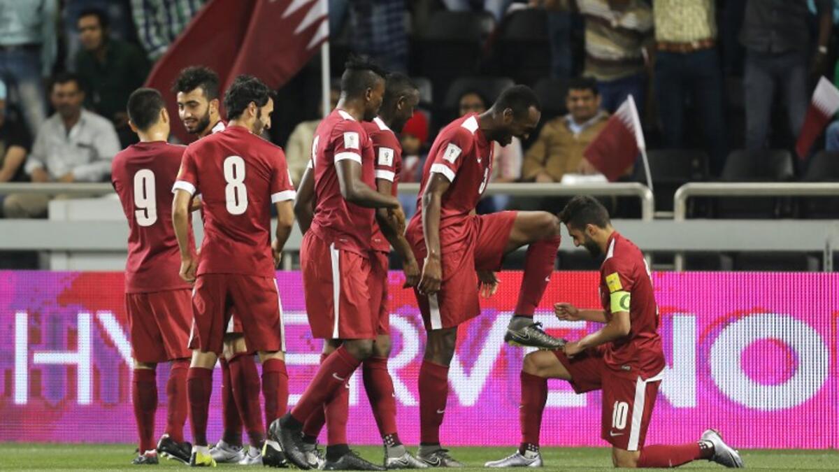 Qatar's Hassan al-Haidos celebrates his goal with teammates during of their World Cup 2018 Asian qualifying football match against Hong Kong on March 24, 2016 at Jassim Bin Hamad Stadium in Doha.
KARIM JAAFAR / AFP