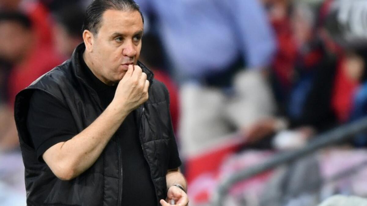 Tunisia's coach Nabil Maaloul eats dates during friendly match between Tunisia and Turkey at the Stade de Geneve stadium in Geneva on June 1, 2018. Maaloul said he had asked goalkeeper, Mouez Hassen, to simulate an injury to allow his players to break the fast of Ramadan.
Fabrice COFFRINI / AFP
