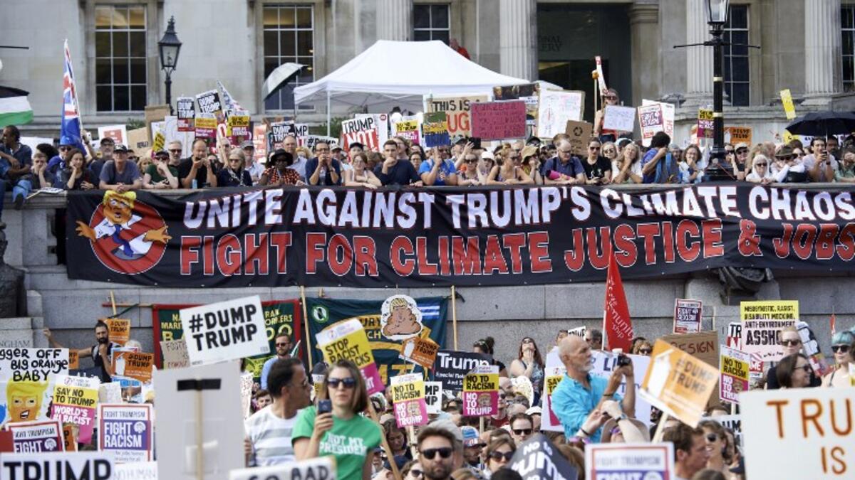 Protesters against the UK visit of US President Donald Trump gather in Trafalgar Square after taking part in a march in London on July 13, 2018. (Niklas HALLEN / AFP)