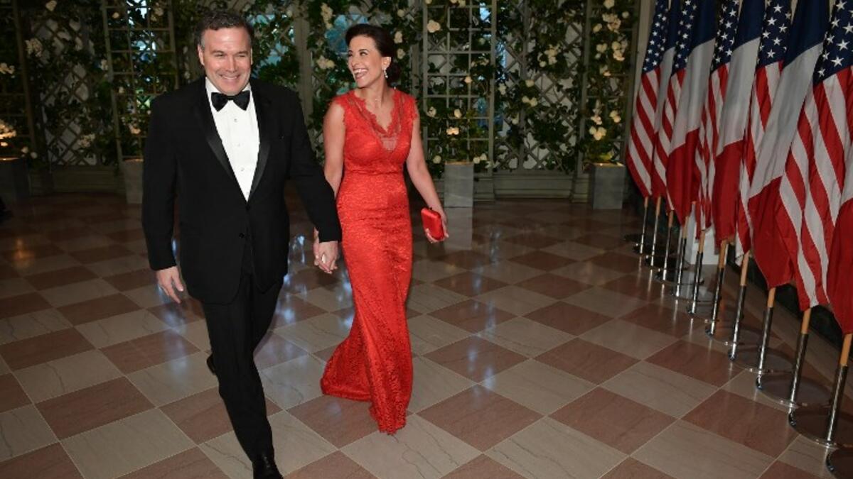US policy strategist Dina Powell and husband Richard Powell arrive in the “Booksellers Area” of the White House to attend a state dinner honoring France's President Emmanuel Macron on April 24, 2018 in Washington, DC. 
MANDEL NGAN / AFP