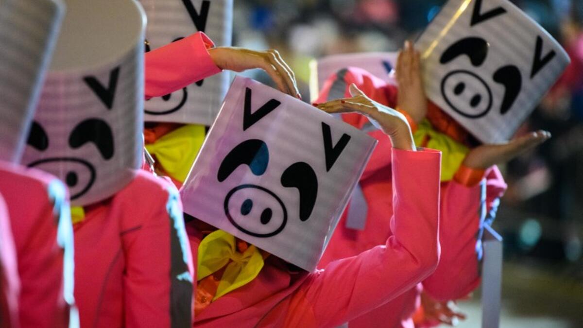 Performers wear pig costumes as they take part in the annual Lunar New Year parade in the Kowloon district of Hong Kong on February 5, 2019, to mark the Year of the Pig. 
Anthony WALLACE / AFP