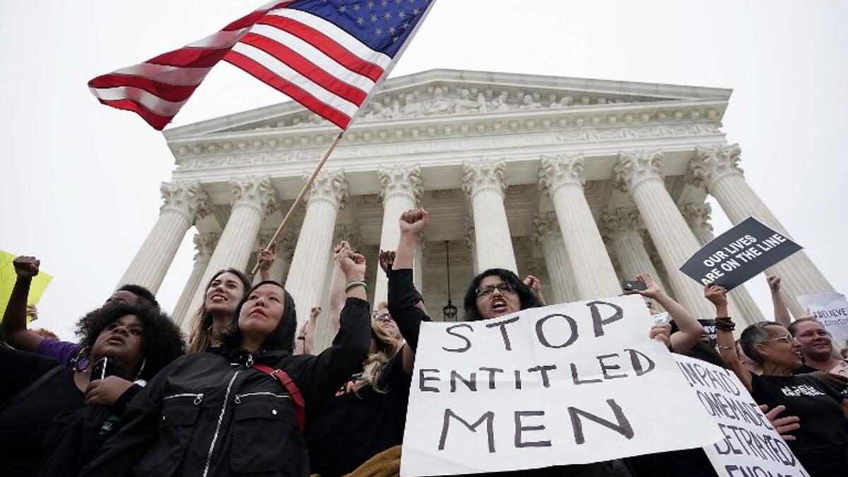 Activists occupy the front steps of the U.S. Supreme Court to protest against the confirmation Judge Brett Kavanaugh to the Supreme Court October 6, 2018 in Washington, DC.  (Alex Wong/Getty Images/AFP)