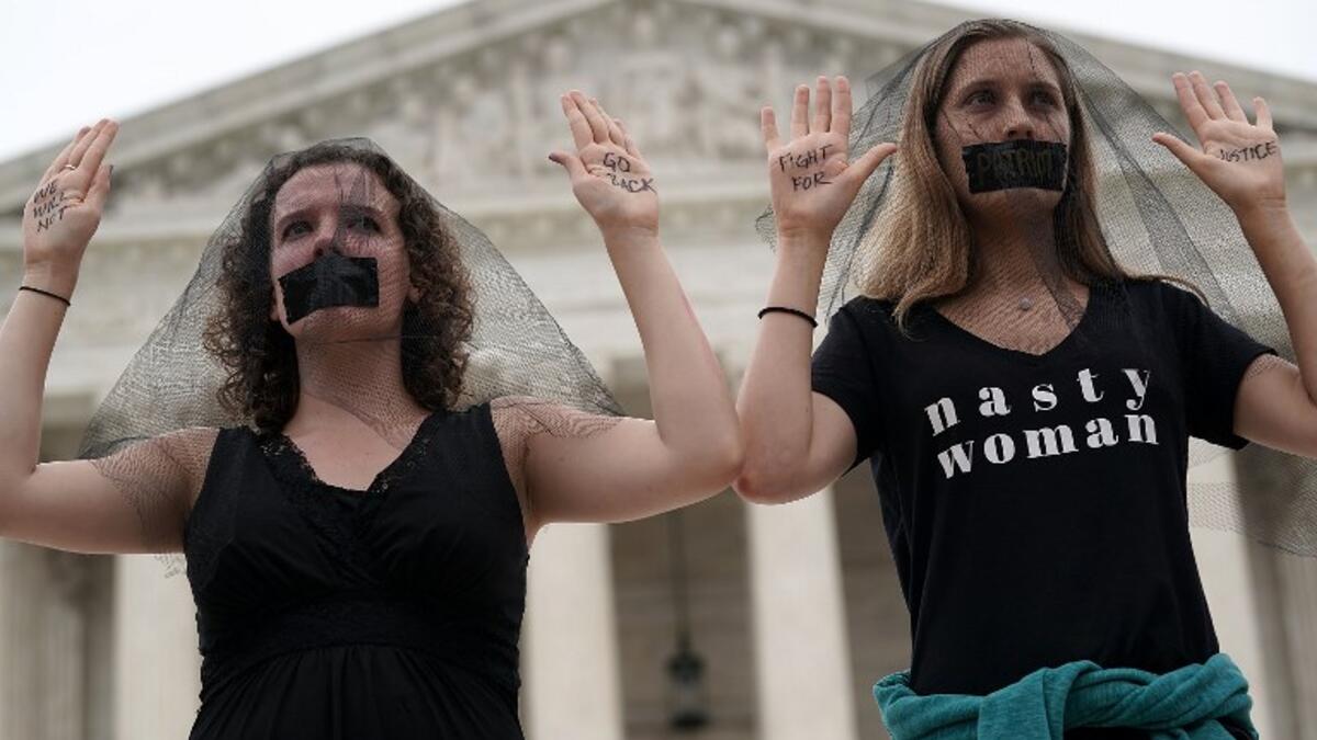Activists occupy the front steps of the U.S. Supreme Court to protest against the confirmation of Judge Brett Kavanaugh to the Supreme Court October 6, 2018 in Washington, DC. (Alex Wong/Getty Images/AFP)