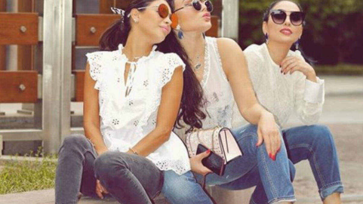 The Lebanese diva and her sisters sported casual looks with denim tight pants