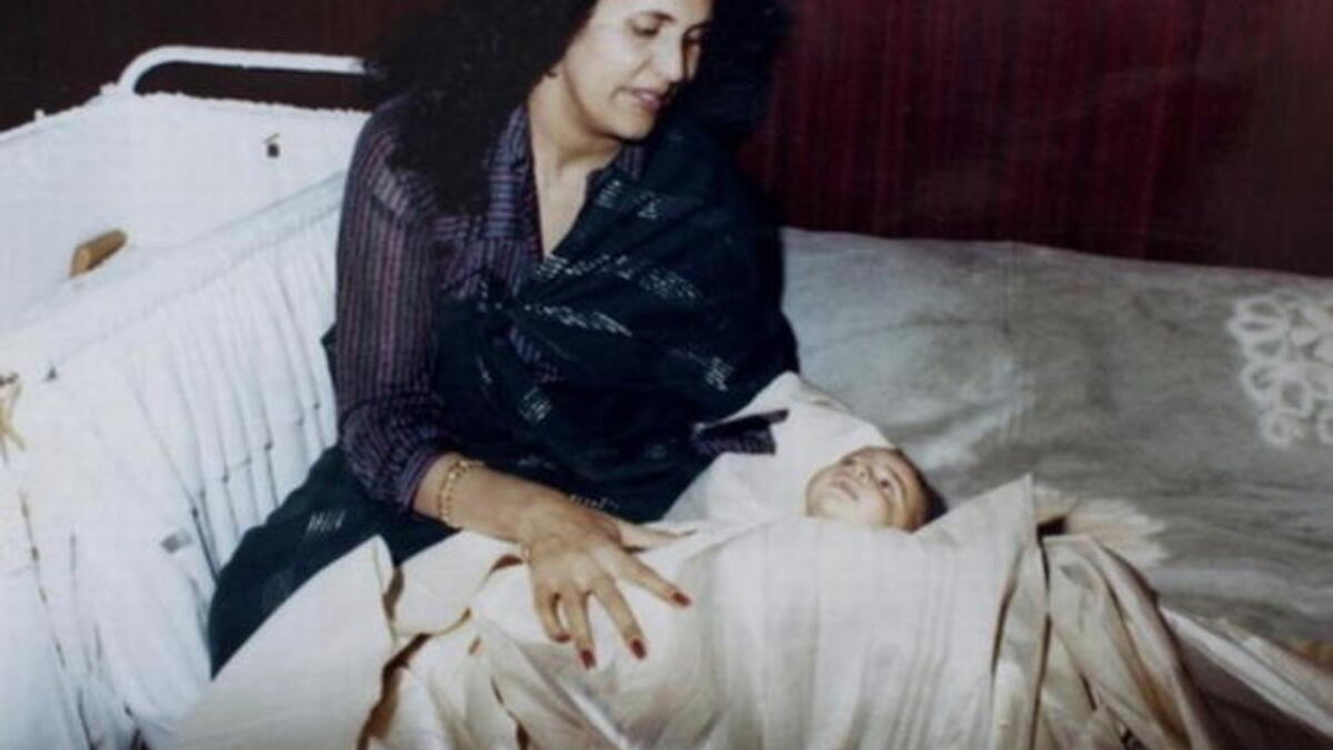 Family album documents Gaddafi children from cradle to grave, in Saifs al-Arab's case:  A special milestone moment, 
mother and newborn, 
celebrating Saif's circumcision ritual-- much like a
Christening. Saif is rumored to have died April 30, 2011, together with some members of the junior Gaddafi tribe, in a 
Nato raid.
