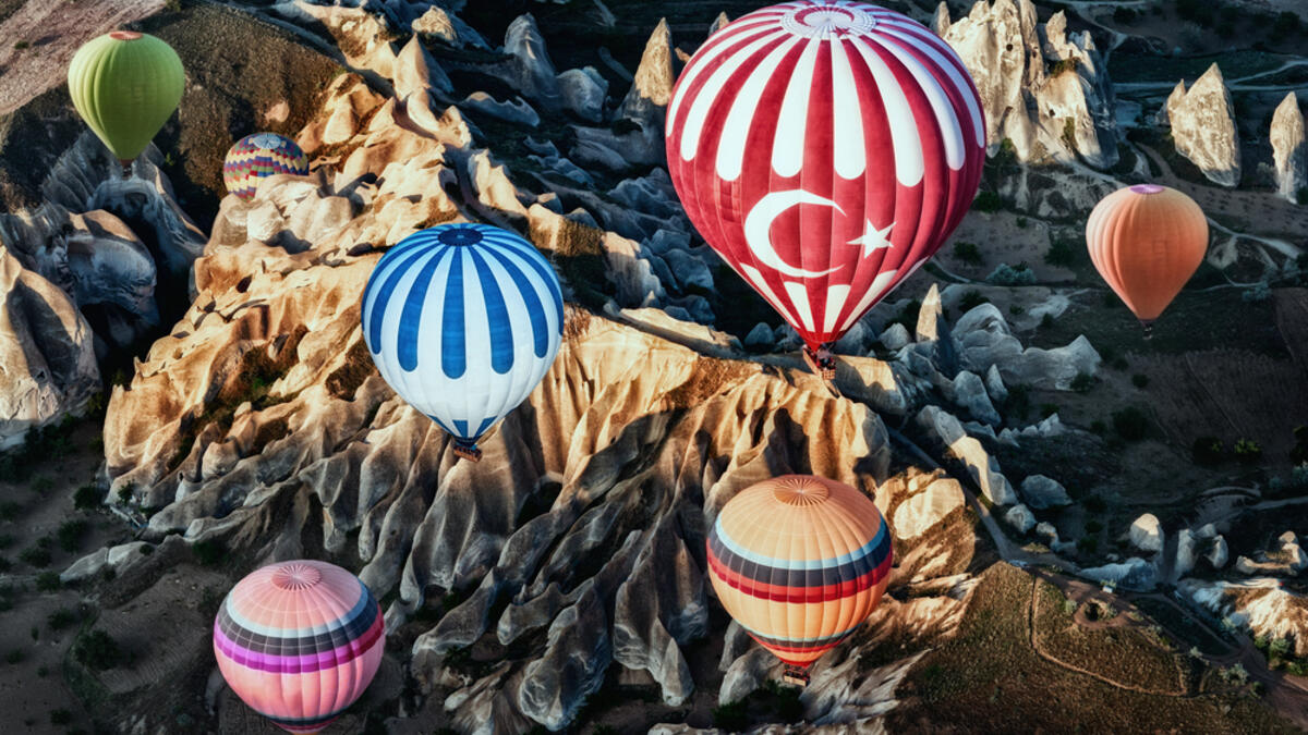 Colorful hot air balloons over mountain landscape in Cappadocia, Goreme National Park Turkey (Shutterstock/File Photo)