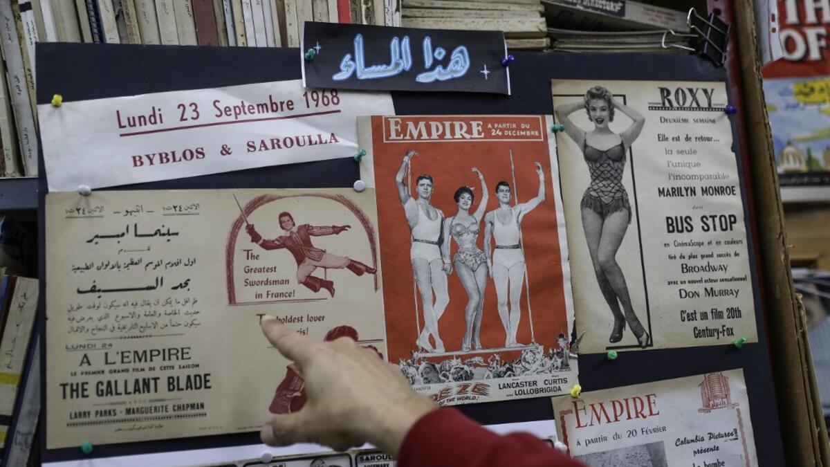Abboudi Abu Jawdeh shows part of his vintage cinema poster collection at his office in the Lebanese capital Beirut  JOSEPH EID / AFP