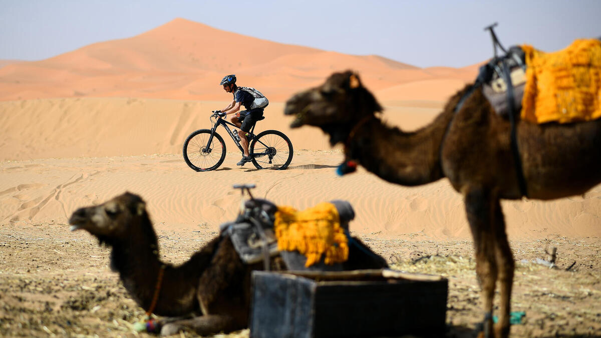 A competitor rides during a training session on April 27, 2019, on the eve of the start of the 14rd edition of Titan Desert 2019 around Merzouga in Morocco. Titan desert 2019, a mountain bike race (640km) snakes between Merzouga and Maadid from April 28 to May 3. FRANCK FIFE / AFP
