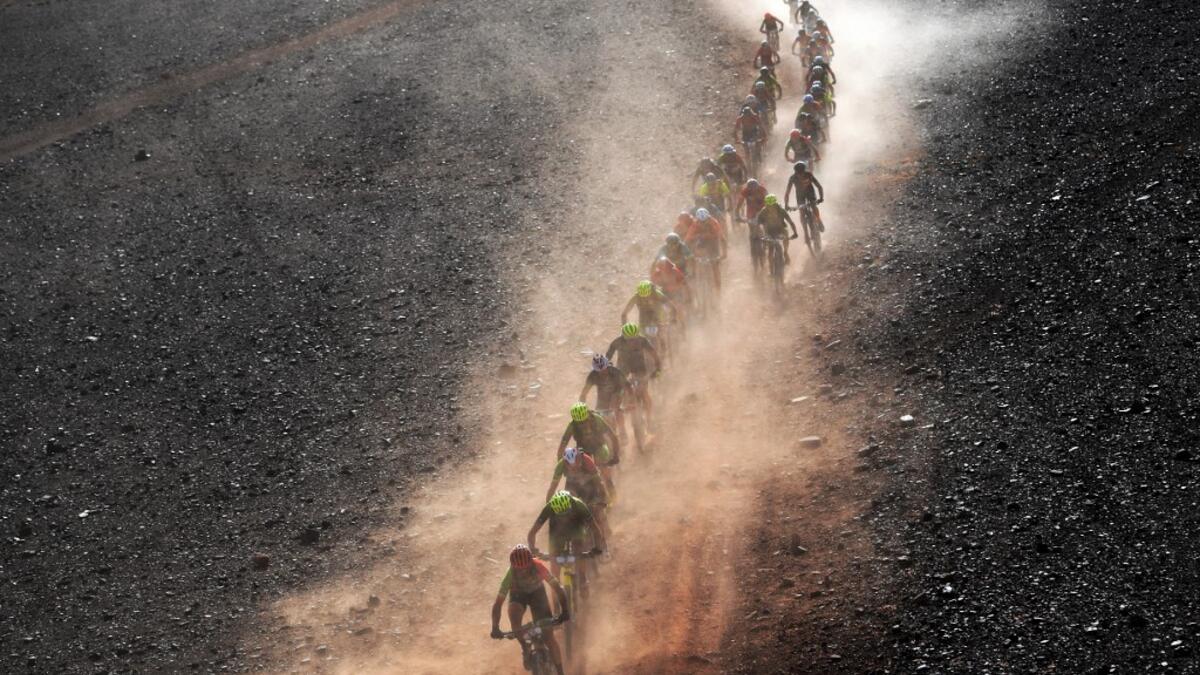 Competitors ride their bikes during Stage 4 of the 14th edition of Titan Desert 2019 mountain biking race between Merzouga and M’ssici, in Morocco, on May 1, 2019.  FRANCK FIFE / AFP