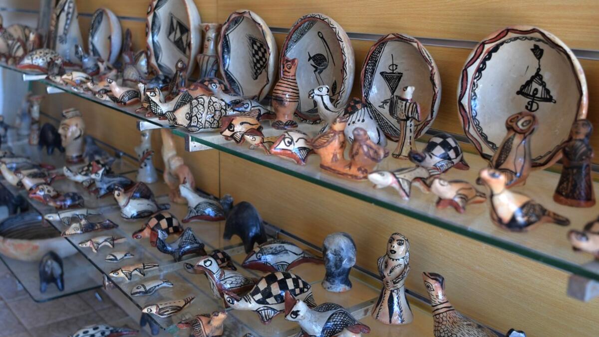 Pottery crafted in Sejnane is displayed at a souvenir shop in the Tunisian capital Tunis. FETHI BELAID / AFP