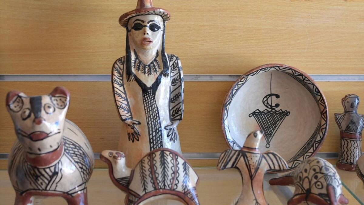Pottery crafted in Sejnane is displayed at a souvenir shop in the Tunisian capital Tunis. FETHI BELAID / AFP