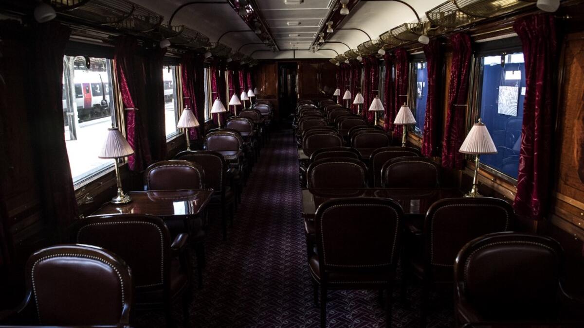 This picture taken on May 13, 2019 shows the interior of a restored carriage of an Orient Express train displayed at the Gare de l'Est train station in Paris.  Christophe ARCHAMBAULT / AFP