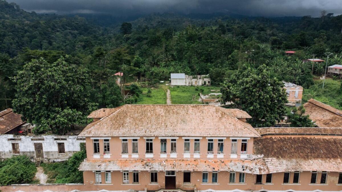 A picture taken on May 12, 2019 shows an aerial view of the hospital of the roca Agostinho Neto, an abandoned cocoa plantation of Sao Tome and Principe.  Alexis HUGUET / AFP