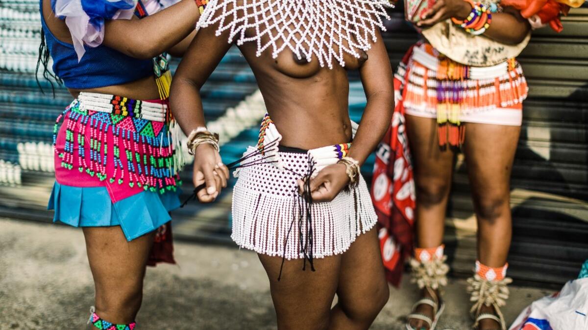 Young women dress up in traditional attire before taking part in auditions organised by the Indoni Culture School in the South African city of Durban. Rajesh JANTILAL / AFP