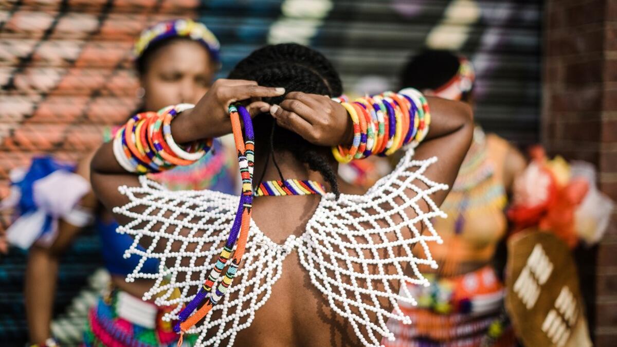 Young women dress up in traditional attire before taking part in auditions organised by the Indoni Culture School in the South African city of Durban. Rajesh JANTILAL / AFP
