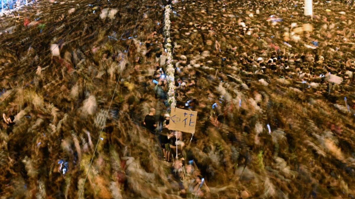 Hundreds of thousands of protesters choked Hong Kong's streets for a second straight on June 16 in a defiant rebuke of a reviled extradition law, piling pressure on the city's embattled pro-Beijing leader despite a weekend climbdown. HECTOR RETAMAL / AFP
