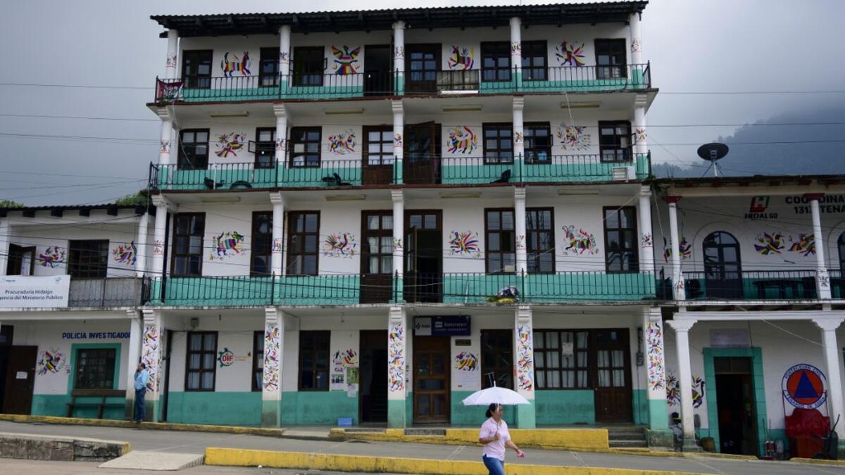 View of the facade of a bullding in Tenango de Doria decorated with designs by San Nicolas artisans, in Tenango de Doria, Hidalgo state, Mexico.  Pedro PARDO / AFP