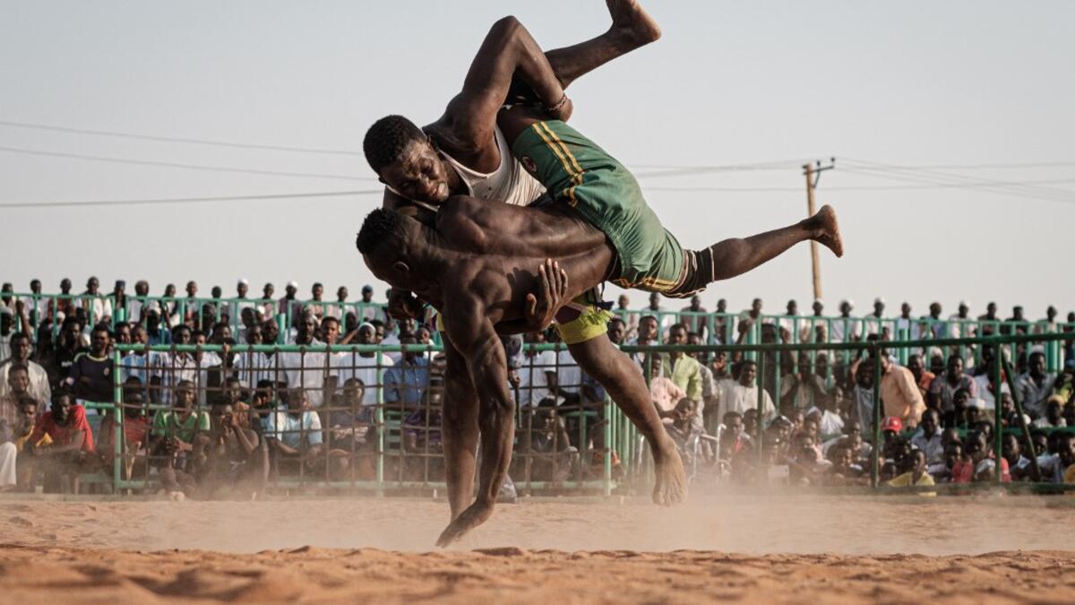 Originating in the Nuba mountains, the sport has become wildly popular country-wide in recent years. The Sudanese Nuba wrestling federation organizes matches every Friday that attract hundreds of people. Yasuyoshi CHIBA / AFP