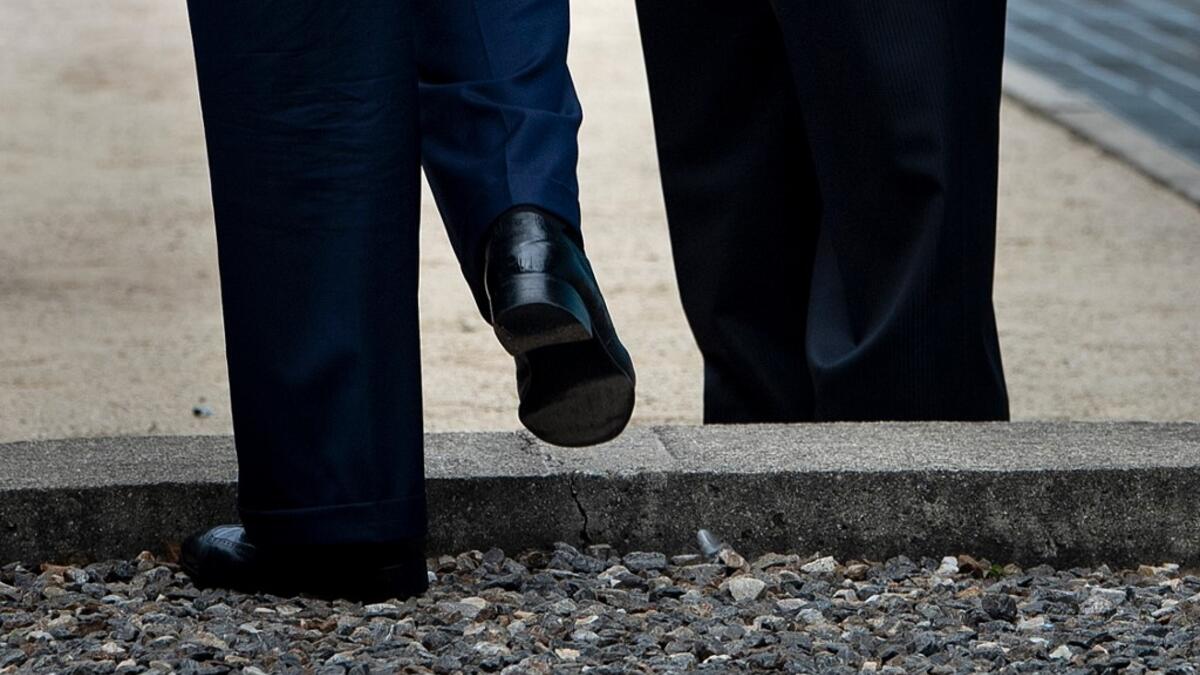 US President Donald Trump steps into North Korea as North Korea's leader Kim Jong-un waits in the Demilitarized Zone (DMZ) on June 30, 2019, in Panmunjom, Korea.  Brendan Smialowski / AFP