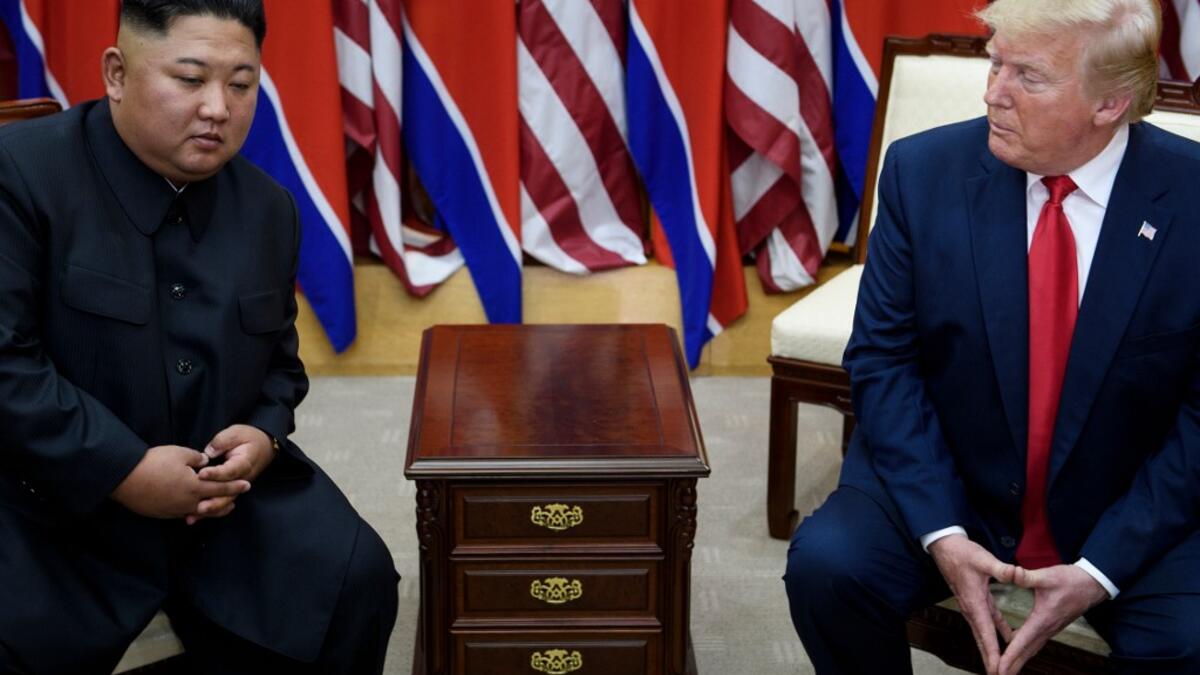 North Korea's leader Kim Jong-un and US President Donald Trump before a meeting in the Demilitarized Zone (DMZ) on June 30, 2019, in Panmunjom, Korea.  Brendan Smialowski / AFP