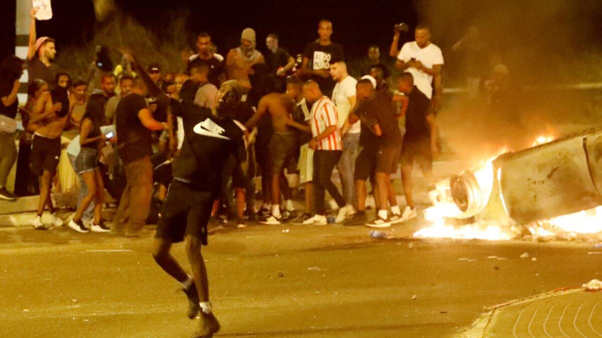 Angry protesters clashed with Israeli police on July 2 over an off-duty officer's killing of a young man of Ethiopian origin, as the incident drew fresh accusations of racism.  JACK GUEZ / AFP
