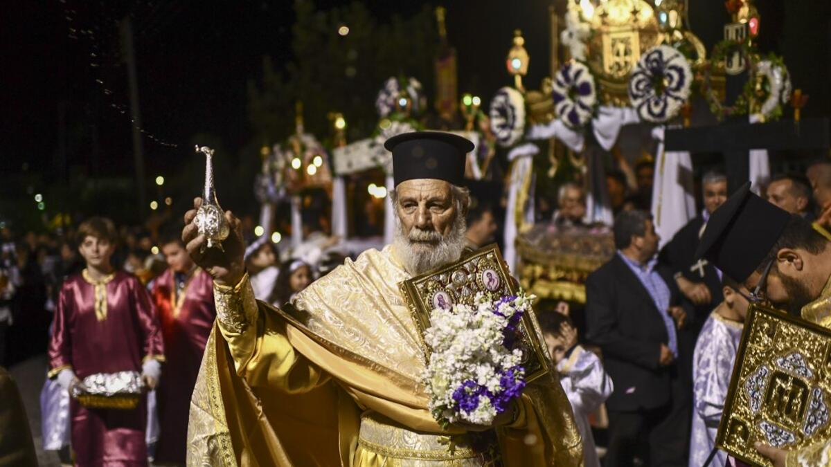 Millions of Greeks flock to churches around the country this week to celebrate Easter, the country's foremost religious celebration. ARIS MESSINIS / AFP