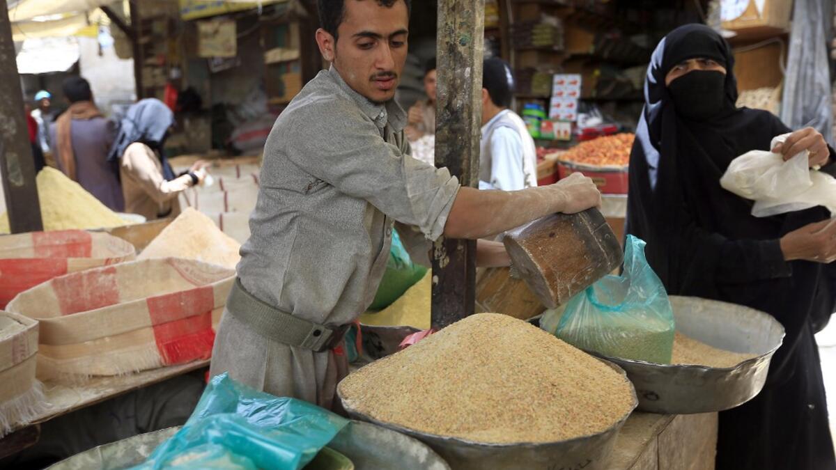 A Yemeni vendor sells grain in a market in the old city of the capital Sanaa, as the faithful prepare for the Muslim holy fasting month of Ramadan, on May 2, 2019. Mohammed HUWAIS / AFP