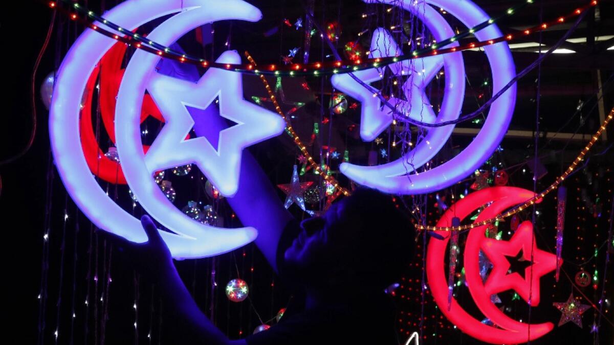 Muslims around the world prepare for the announcement of the fasting month of Ramadan which is expected to start on May 5 or 6 depending on the crescent moon.  AHMAD GHARABLI / AFP