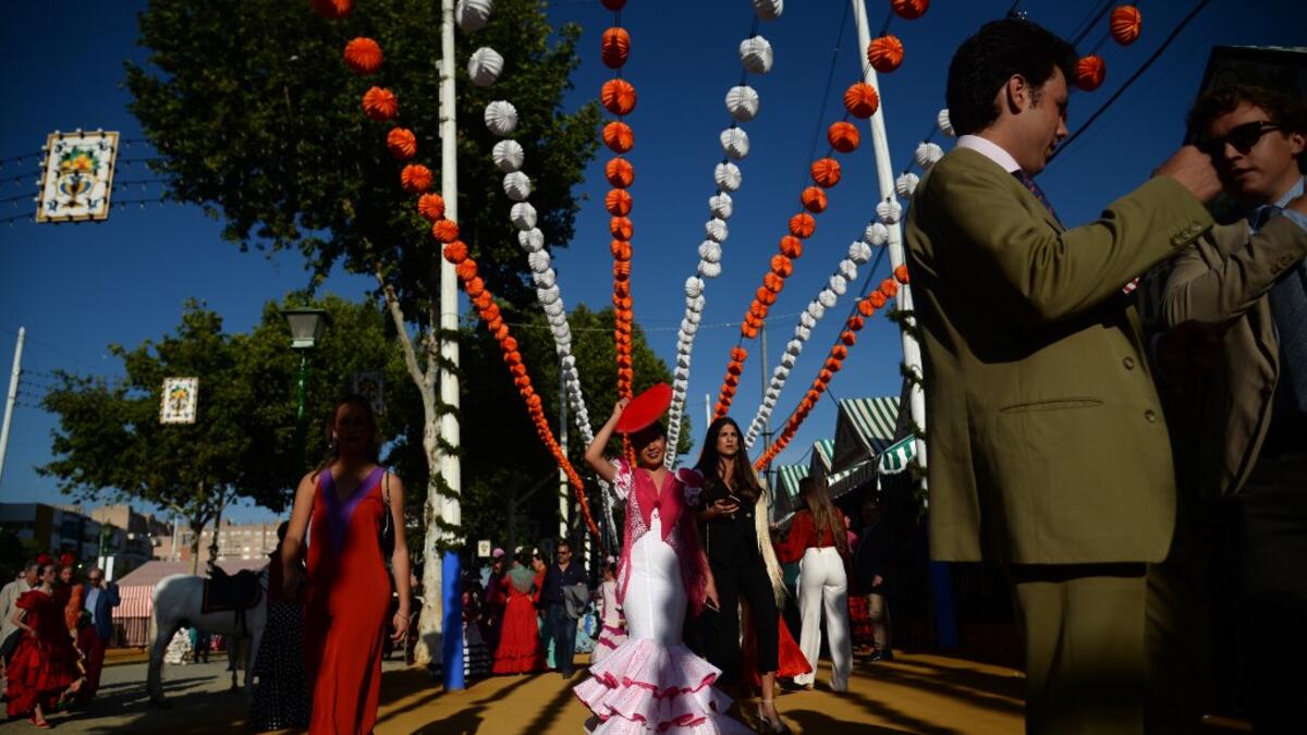 The fair dates back to 1847 when it was originally organized as a livestock fair but has turned into a week of flamenco dancing, music and bullfighting.  CRISTINA QUICLER / AFP