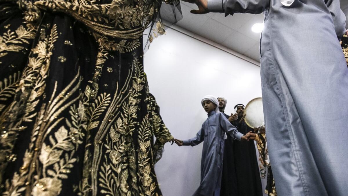 Members of a traditional music and dance group perform at the first cultural centre to open since the ISIS rule ended in the eastern Syrian city of Raqa on May 1, 2019. DELIL SOULEIMAN / AFP