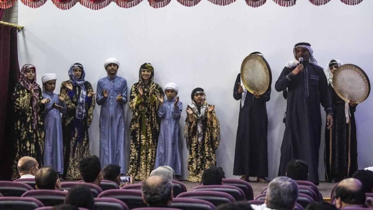 Members of a traditional music and dance group perform at the first cultural centre to open since ISIS ended  its rule in the eastern Syrian city of Raqa on May 1, 2019. DELIL SOULEIMAN / AFP