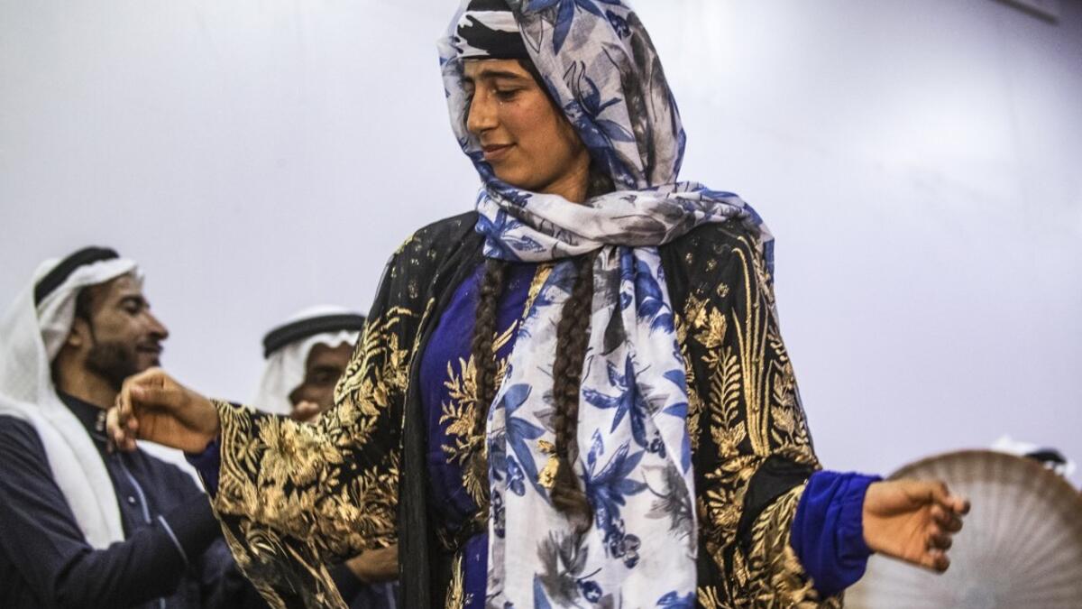 Sunlight floods into a brand new library at the cultural centre where books line shelves along a wall that still smells of wet paint. DELIL SOULEIMAN / AFP
