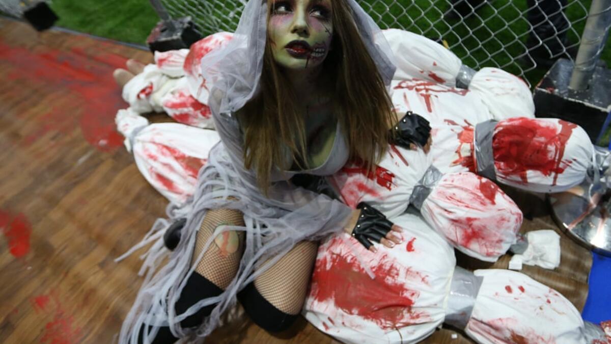 A guest dressed as a zombie attends the Middle East Film & Comic Con (MEFCC). (Twitter)