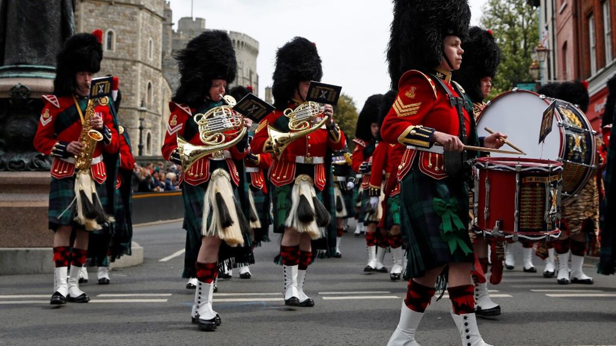 Members of the Band of the Royal Regiment of Scotland perform in the Changing of the Guard ceremony at Windsor Castle in Windsor, west of London on May 7, 2019. ADRIAN DENNIS / AFP