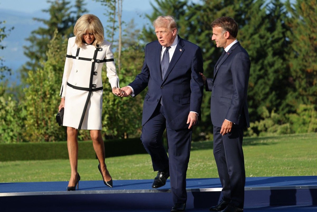 Video: Trump rebuked for holding hand of Brigitte Macron at G7 meeting Video: Trump rebuked for holding hand of Brigitte Macron at G7 meeting