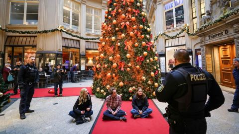 Christmas defiled: German climate activists spray Christmas trees with orange paint