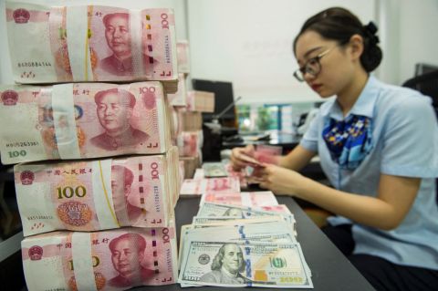 Yuan hits three-year high against dollar